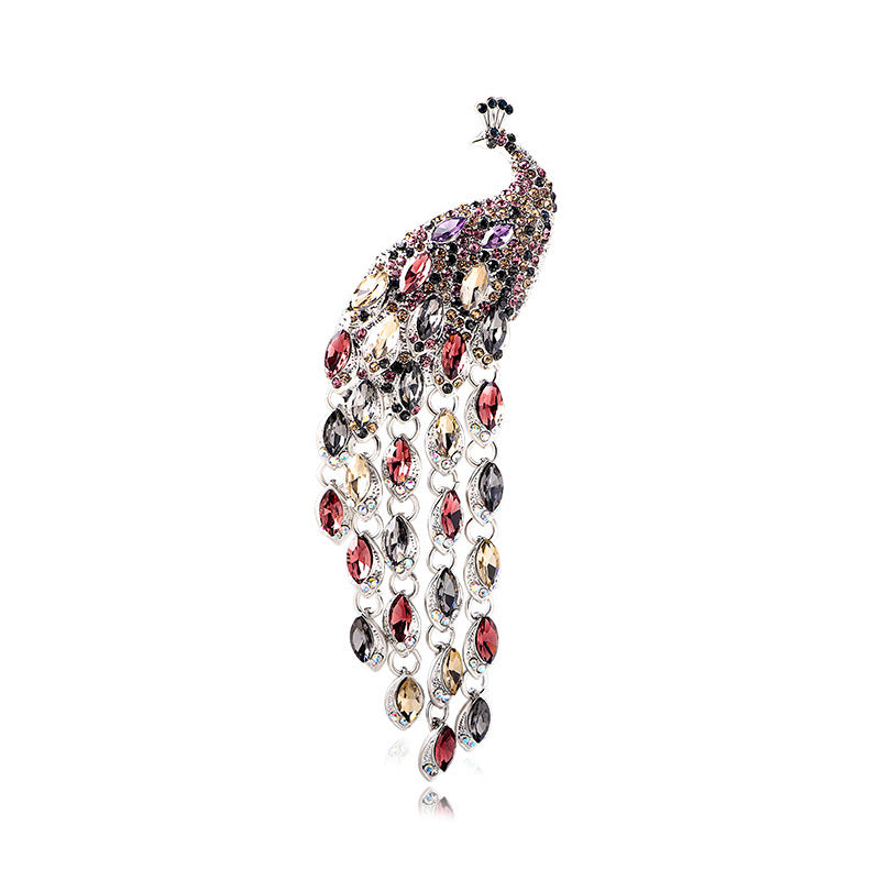 Elegant brooch with blue gemstones on a white background