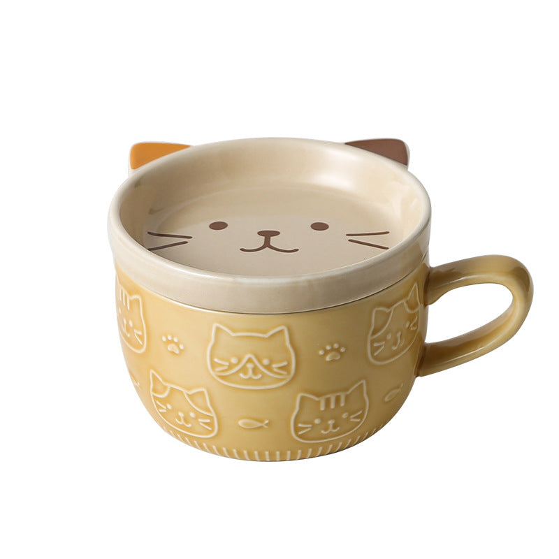 Cat-shaped mug with a beige exterior and white interior on a white background