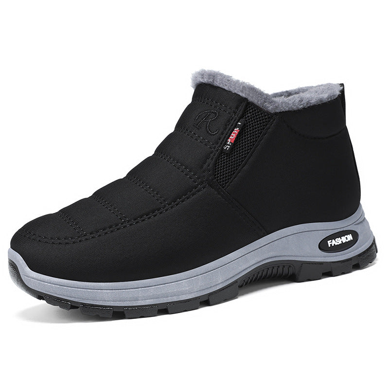 Black winter boot with gray sole on a white background