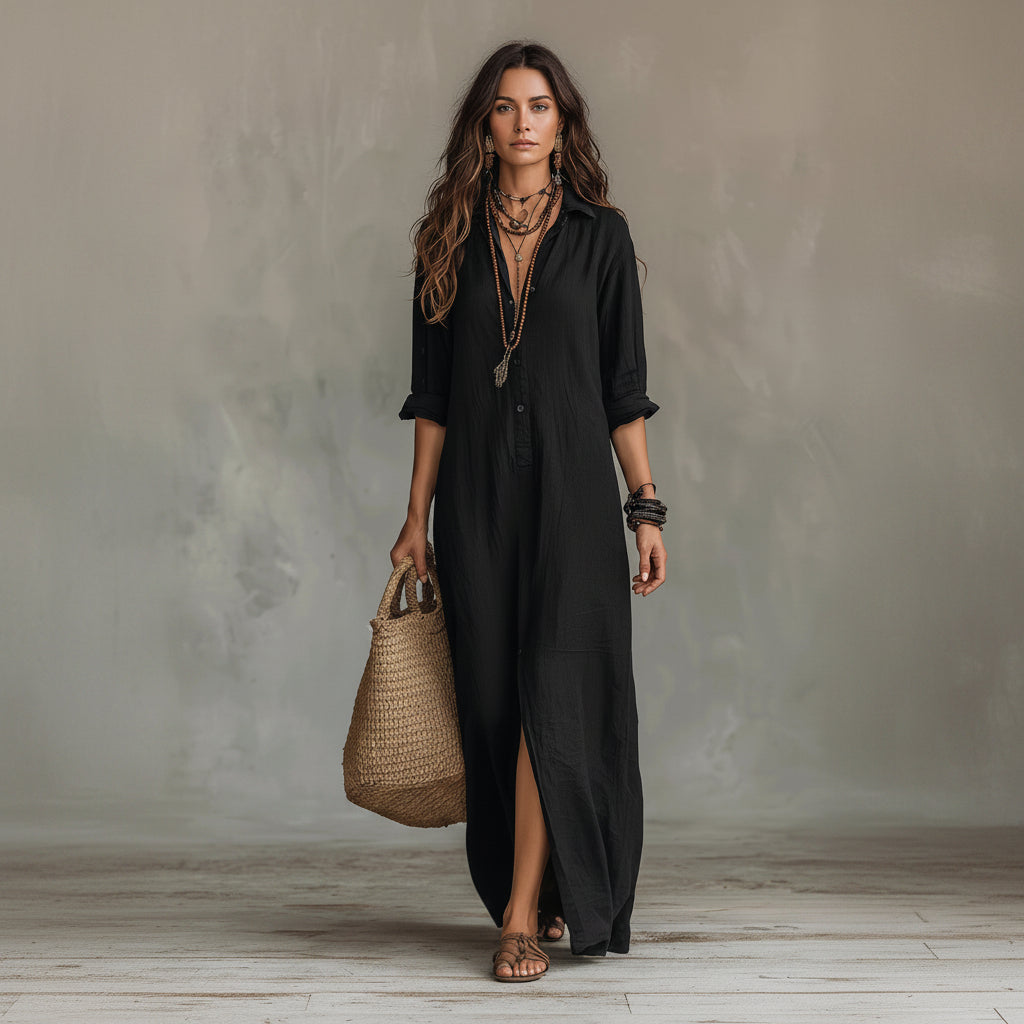 Woman wearing a black dress holding a woven bag against a neutral background